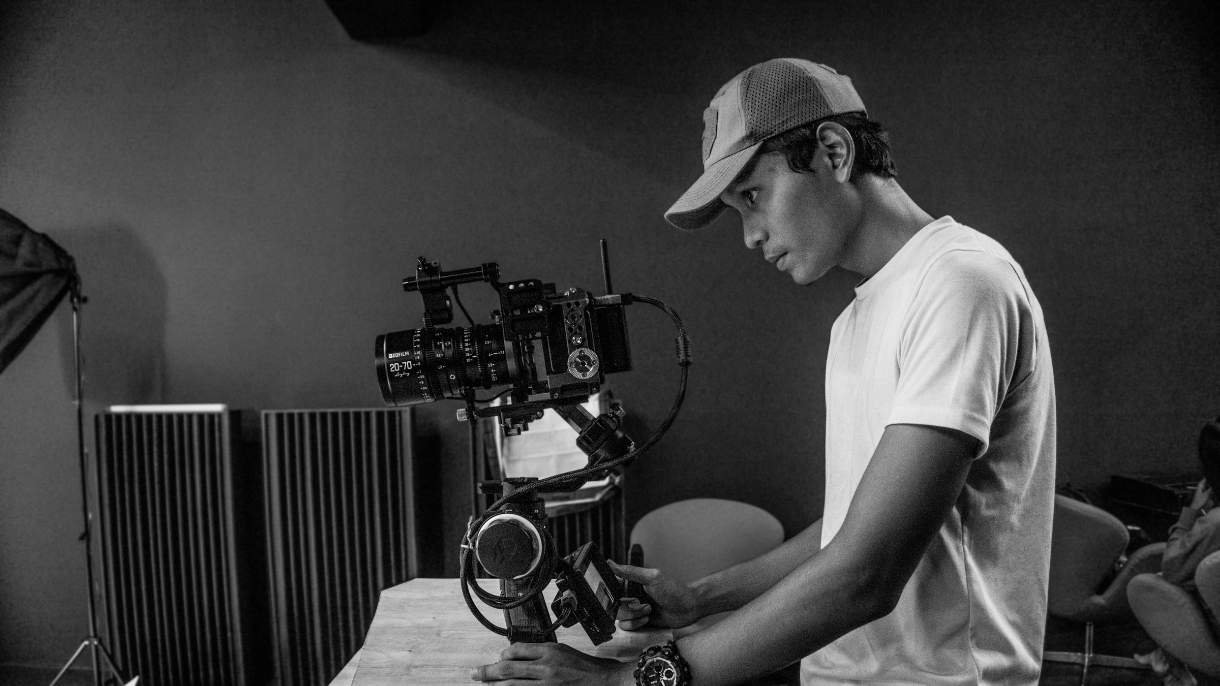 Videographer Setting Up His Camera